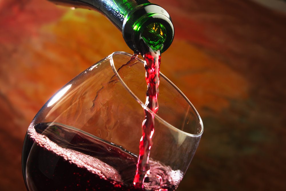 Red wine being poured into wine glass